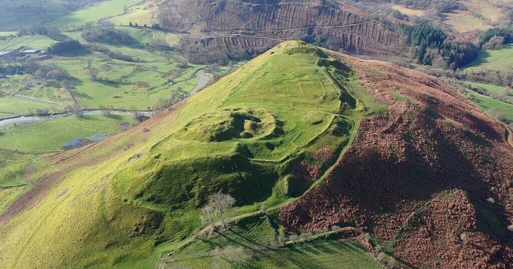 Aerial shot of Cefnllys Castles, earthwork ditches on a spur hill near Llandrindod Powys.